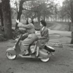 1950 two ladies on Lambretta scooter next to trees