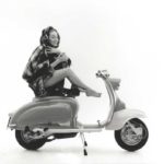 1958 lady sitting on Lambretta scooter with blanket