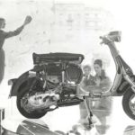 1960 Lambretta scooter in shop window with two persons looking