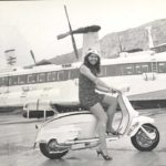 1966 Lambretta scooter with woman in fornt of Seaspeed boat