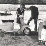 1968 men and woman with two Lambretta scooters river